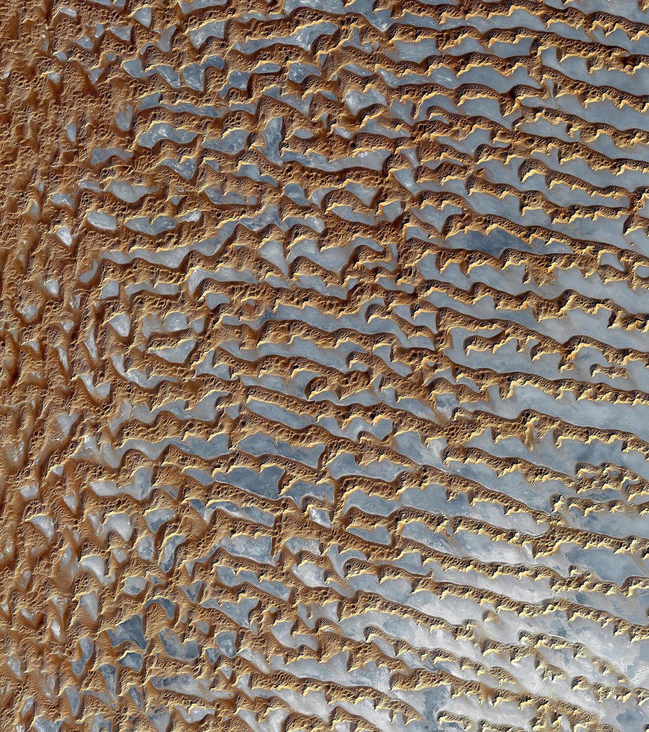 A sand sea seen from orbit — desert on a continental scale
